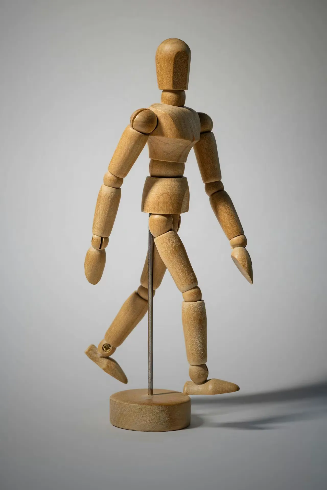 Small wooden figure showcasing human movement