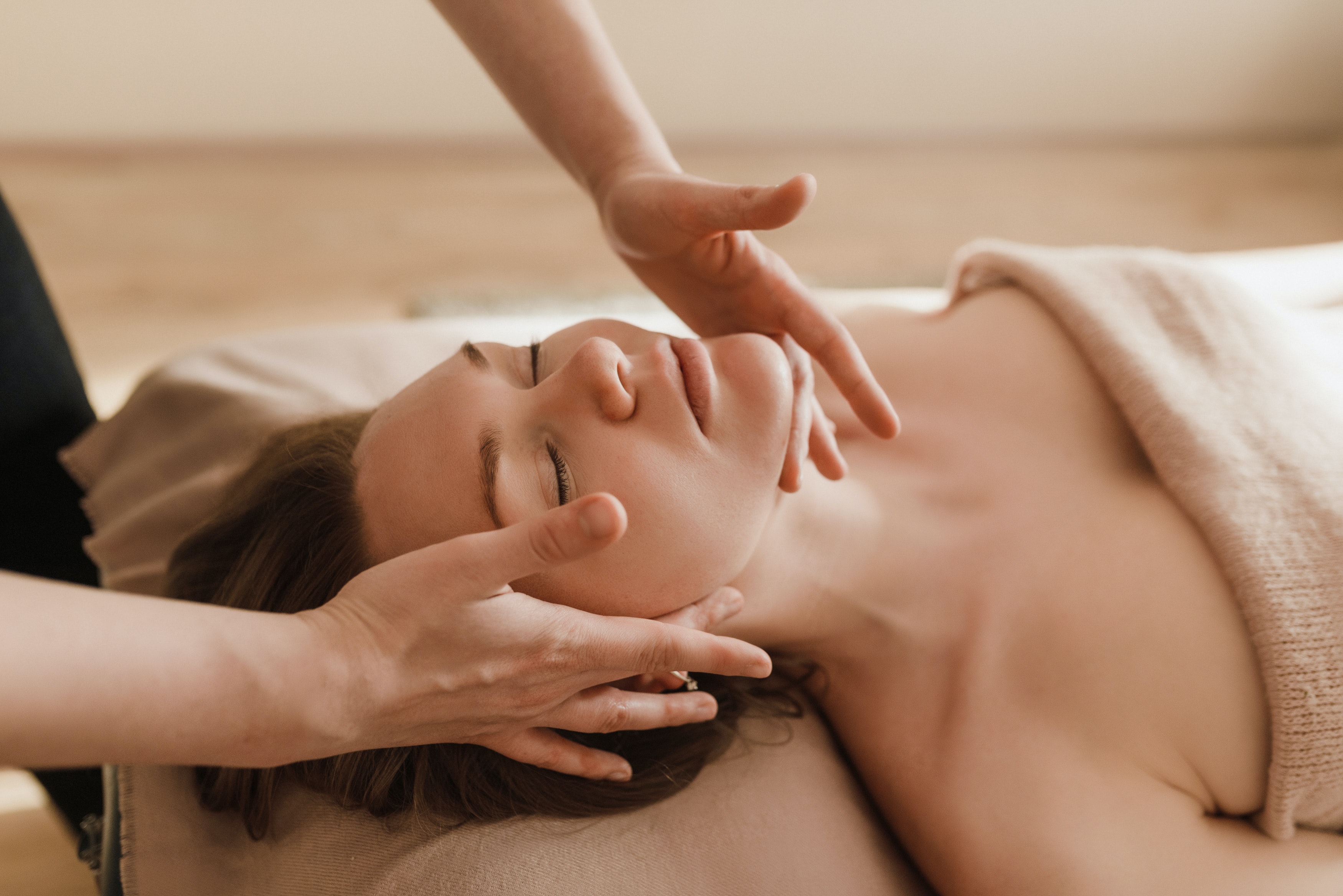 Massage Therapist Performing Facial Massage
