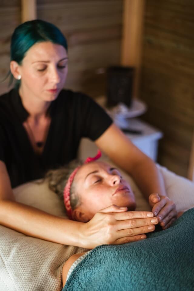 Massage Therapist performing Swedish Massage on Client